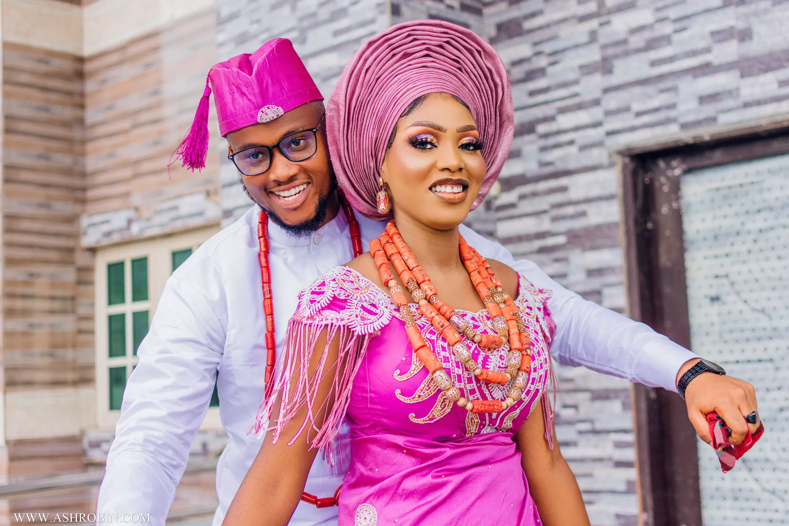 portrait of couple in their urhobo traditional wedding dress