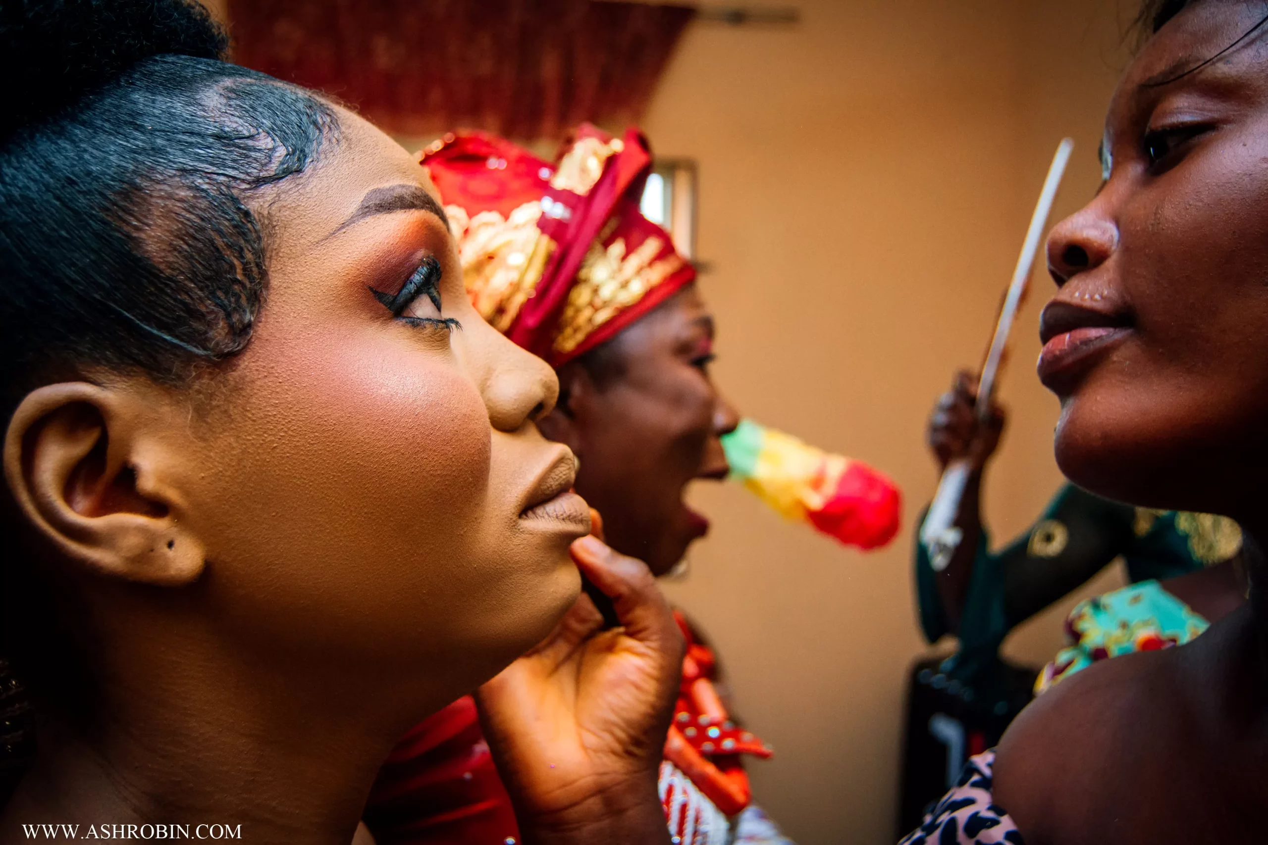 nigerian bride doing makeup and crying while her mom sings for her